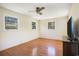 Sunny bedroom with hardwood floors and multiple windows for ample natural light at 5612 N Kings Hwy., Myrtle Beach, SC 29577