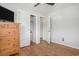 Bedroom featuring hardwood floors, a double-door closet, and doorways at 5612 N Kings Hwy., Myrtle Beach, SC 29577