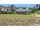 Charming two-story home with a brick chimney and covered patio, surrounded by a lush green yard at 5612 N Kings Hwy., Myrtle Beach, SC 29577