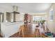 Open kitchen/living with stainless vent hood, island with stool seating and hardwood floors at 5612 N Kings Hwy., Myrtle Beach, SC 29577
