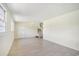 Spacious living room with tiled floor, recessed lighting, and stairs to upper level at 5612 N Kings Hwy., Myrtle Beach, SC 29577