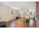 Bright living room featuring hardwood floors, recessed lighting, and open access to a modern kitchen at 5612 N Kings Hwy., Myrtle Beach, SC 29577