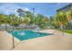 Community pool surrounded by palm trees and lounge chairs at 5905 S Kings Hwy. # 344B, Myrtle Beach, SC 29575