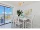 Elegant dining area boasting a glass table and outside views at 5905 S Kings Hwy. # 344B, Myrtle Beach, SC 29575