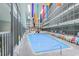 Spacious indoor pool area with colorful flags and lounge chairs at 5905 S Kings Hwy. # 344B, Myrtle Beach, SC 29575