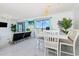 Open living space featuring a dining area with ample natural light at 5905 S Kings Hwy. # 344B, Myrtle Beach, SC 29575
