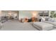 Open loft area with plush carpeting, comfortable seating, and bright, airy atmosphere at 614 Forage Dr, Conway, SC 29526