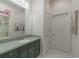 Bathroom featuring a single sink vanity with green counters and drawers and a large mirror at 616 Edgecreek Dr., Myrtle Beach, SC 29579
