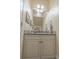 Cozy powder room with a decorative mirror, vanity with drawers and cabinet, and unique accents at 616 Edgecreek Dr., Myrtle Beach, SC 29579