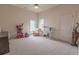 Bedroom features light carpet, great lighting, and a desk for working or studying at 616 Edgecreek Dr., Myrtle Beach, SC 29579