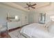 Bright main bedroom boasts a dresser, large mirror, area rug and access to ensuite bathroom at 616 Edgecreek Dr., Myrtle Beach, SC 29579