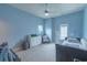 Bedroom features a ceiling fan, neutral-colored walls, and natural lighting at 616 Edgecreek Dr., Myrtle Beach, SC 29579