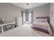 Comfortable bedroom with plush carpeting, large windows, and a cozy bed, perfect for relaxation at 616 Edgecreek Dr., Myrtle Beach, SC 29579