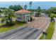Welcoming gatehouse for a secure community, featuring a tile roof and well-maintained landscaping at 616 Edgecreek Dr., Myrtle Beach, SC 29579