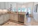 Bright kitchen showcasing tile floors, granite counters, stainless appliances and a chandelier breakfast nook at 616 Edgecreek Dr., Myrtle Beach, SC 29579