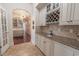 Stylish wet bar featuring custom cabinets, granite countertops, and wine storage at 616 Edgecreek Dr., Myrtle Beach, SC 29579