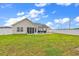 A well-maintained backyard showcases a patio area with outdoor seating, ideal for relaxation and entertainment at 732 American Beech St., Loris, SC 29569