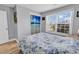 Serene bedroom featuring wood floors, a patterned comforter, and a window with natural light at 732 American Beech St., Loris, SC 29569