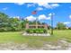 Welcoming entrance sign for Porter's Bay community, adorned with an American flag and landscaping at 732 American Beech St., Loris, SC 29569