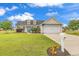 Charming home featuring a well-manicured lawn, two-car garage, and a classic design with dormer windows at 732 American Beech St., Loris, SC 29569
