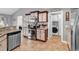 Well-equipped kitchen featuring stainless steel appliances and adjacent laundry area at 732 American Beech St., Loris, SC 29569