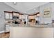 Cozy kitchen featuring granite countertops, stainless appliances, and tile backsplash at 732 American Beech St., Loris, SC 29569