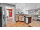 Open kitchen boasts granite countertops, a stainless steel dishwasher, and a dining area at 732 American Beech St., Loris, SC 29569