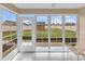 Relaxing sunroom with plenty of natural light overlooking the backyard and shed at 732 American Beech St., Loris, SC 29569