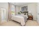 Relaxing bedroom with a cozy bed, natural light, and tasteful decor, providing a comfortable and inviting personal space at 7382 Meadow Walk Loop, Loris, SC 29569
