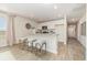 Bright, open kitchen with bar stool seating at the island and modern appliances at 7382 Meadow Walk Loop, Loris, SC 29569