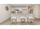 Kitchen island features bar stool seating and stylish finishes, seamlessly connects to other areas at 7382 Meadow Walk Loop, Loris, SC 29569