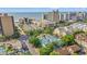Aerial view of city with hotels and condos and row of the light blue townhomes near the ocean at 7403 N Ocean Blvd. # C, Myrtle Beach, SC 29572
