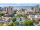 Aerial view of a beachfront property with easy access to the beach and ocean, surrounded by mature trees at 7403 N Ocean Blvd. # C, Myrtle Beach, SC 29572