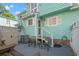 Outdoor patio area featuring outdoor furniture, and access to the unit's back door at 7403 N Ocean Blvd. # C, Myrtle Beach, SC 29572