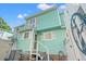 View of the home's rear showing the patio, and stairs to the back door at 7403 N Ocean Blvd. # C, Myrtle Beach, SC 29572