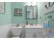 Cozy powder room features a white vanity, charming decor, and a toilet at 7403 N Ocean Blvd. # C, Myrtle Beach, SC 29572