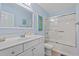 Bathroom featuring a shower-tub combo, vanity and coastal-themed decorations at 7403 N Ocean Blvd. # C, Myrtle Beach, SC 29572