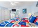 Bedroom with coastal style decor, nautical-themed quilt, and access to the bathroom at 7403 N Ocean Blvd. # C, Myrtle Beach, SC 29572