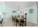 Inviting dining area with stylish lighting, seating for six, and an open flow to the kitchen and living room at 7403 N Ocean Blvd. # C, Myrtle Beach, SC 29572