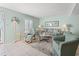 Inviting living room with comfortable seating, natural light and tile floors, perfect for relaxing and entertaining at 7403 N Ocean Blvd. # C, Myrtle Beach, SC 29572