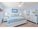 Calm main bedroom features a queen bed, ceiling fan, and natural light at 7403 N Ocean Blvd. # C, Myrtle Beach, SC 29572