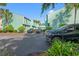 A spacious parking area in front of the blue townhomes with well-maintained landscaping at 7403 N Ocean Blvd. # C, Myrtle Beach, SC 29572