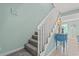 Carpeted staircase with white railing, leading to the bedrooms at 7403 N Ocean Blvd. # C, Myrtle Beach, SC 29572