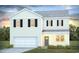 Charming two-story home with a garage, neutral siding, black shutters, and well-maintained landscaping at 7431 Meadow Walk Loop, Loris, SC 29569