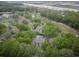 Picturesque aerial view of a complex surrounded by lush greenery and waterfront scenery at 802 Colony Pl. # 2E, Calabash, NC 28468