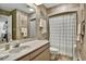 Bathroom featuring wallpaper, a sink, and a shower with curtain at 802 Colony Pl. # 2E, Calabash, NC 28468
