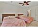 Bedroom featuring two beds, a ceiling fan, and natural lighting at 802 Colony Pl. # 2E, Calabash, NC 28468