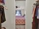 Bedroom view from closet featuring carpet floors and natural light at 802 Colony Pl. # 2E, Calabash, NC 28468