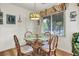 Charming dining area with a glass-top table and decorative lighting at 802 Colony Pl. # 2E, Calabash, NC 28468