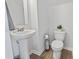 Well-lit half bathroom features modern fixtures and pedestal sink at 863 Agostino Dr., Myrtle Beach, SC 29579